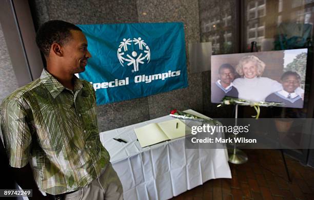 Former special olympian Terriel Limerck looks at a picture of Eunice Kennedy Shriver after signing a condolence book at the Special Olympic...