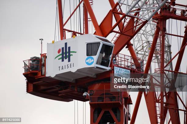 Logo of Taisei Corp. Is displayed on a crane at a construction site in Tokyo, Japan, on Friday, Dec. 22, 2017. Japan's major construction companies,...