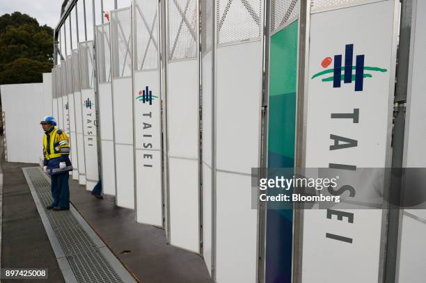 Logos of Taisei Corp. Are displayed on a fence at a construction site in Tokyo, Japan, on Friday, Dec. 22, 2017. Japan's major construction...