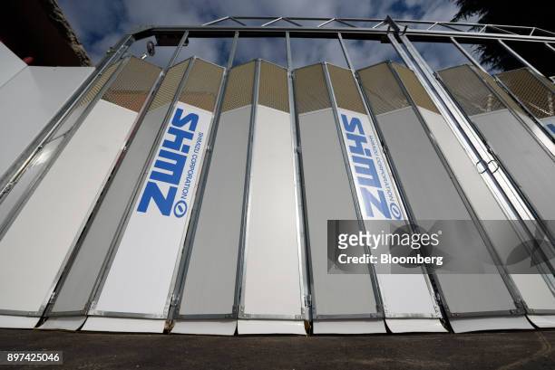 Logos of Shimizu Corp. Are displayed on a fence at a construction site in Tokyo, Japan, on Friday, Dec. 22, 2017. Japan's major construction...