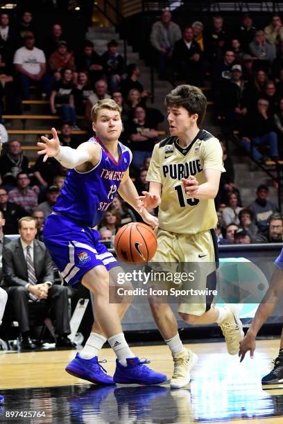 Tommy Luce guard Purdue University Boilermakers loses control of the basketball against Hampus Ahlin forward Tennessee State University Tigers,...