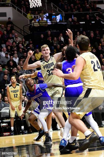 Matt Haarms 7-3 forward Purdue University Boilermakers and Armani Chaney 5-10 guard Tennessee State University Tigers wait to rebound the basketball,...