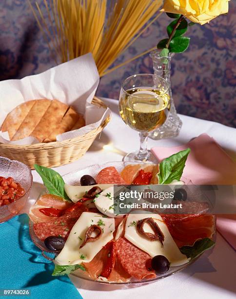 antipasto with wine and bread - provolone stock-fotos und bilder