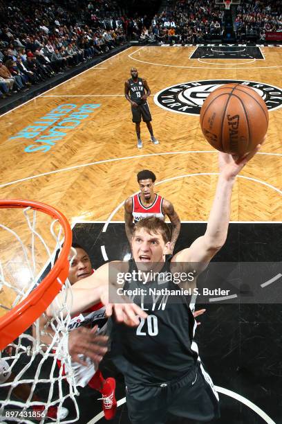 Timofey Mozgov of the Brooklyn Nets shoots the ball against the Washington Wizards on December 22, 2017 at Barclays Center in Brooklyn, New York....