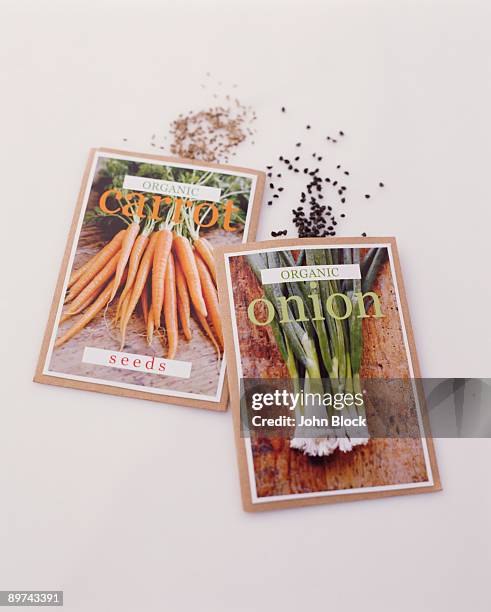 onion and carrot seed packets - seed packet stock pictures, royalty-free photos & images