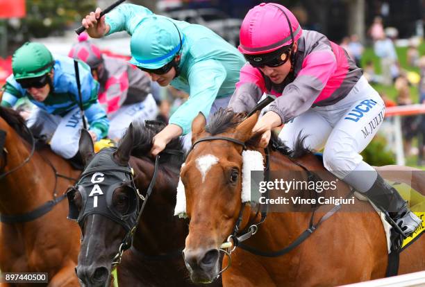 Melissa Julius riding Straight Jacket defeats Zac Spain riding Multitude in Race 4 during Melbourne Racing at Moonee Valley Racecourse on December...