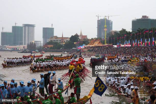 Cambodian participants row their dragon boats on the Tonle Sap river during the closing ceremony of the Water Festival boat race. The country's...
