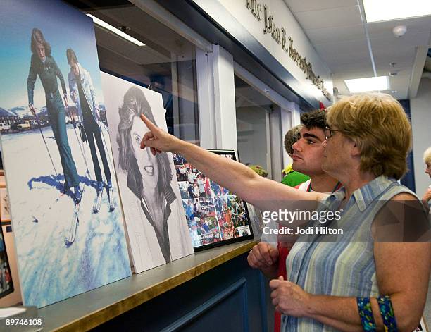 Special Olympian Joseph Capello and his mother, Gail Capello, Mid-Cape Special Olympics coordinator, look at photos of Eunice Kennedy Shriver on...