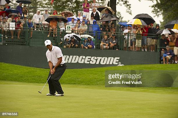 Bridgestone Invitational: Tiger Woods in action, missing birdie putt on No 17 during Saturday play at Firestone CC. Rain, weather. Akron, OH 8/8/2009...