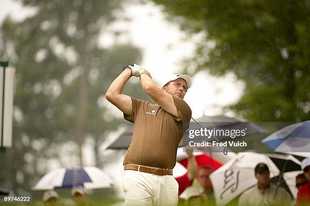 Bridgestone Invitational: Phil Mickelson in action, drive from tee on No 15 during Saturday play at Firestone CC. Rain, weather. Akron, OH 8/8/2009...