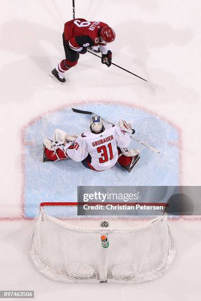 Clayton Keller of the Arizona Coyotes shoots to score the game winning goal past goaltender Philipp Grubauer of the Washington Capitals in overtime...