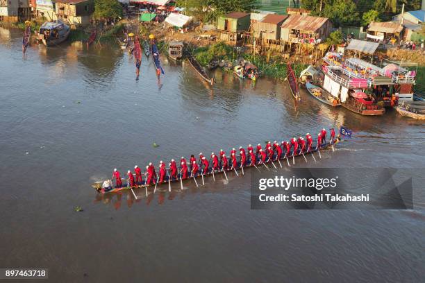 Cambodian dragon boat crew members row their boat on the Tonle Sap river after the first day of the three-day Water Festival boat race. The country's...