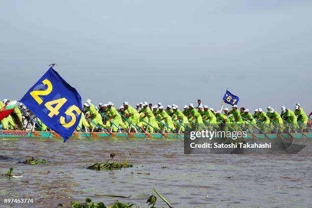 Cambodian dragon boat crew members row their boat on the Tonle Sap river during the second day of the three-day Water Festival boat race. The...