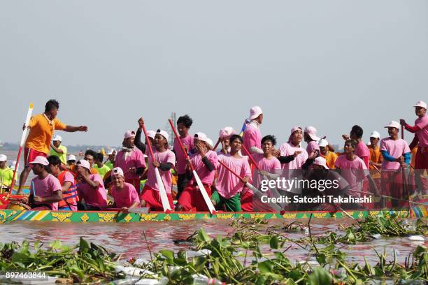 Cambodian dragon boat crew members row their boat on the Tonle Sap river during the second day of the three-day Water Festival boat race. The...