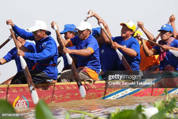 Cambodian dragon boat crew members row their boat on the Tonle Sap river during the second day of the three-day Water Festival boat race. The...