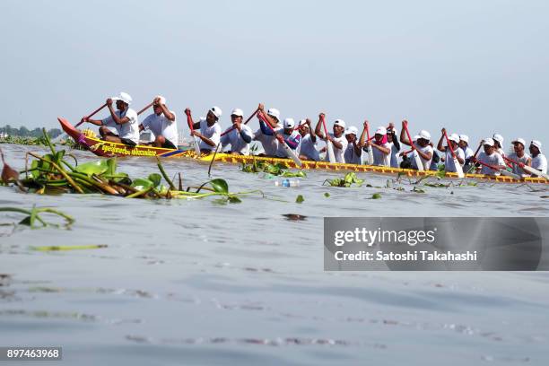 Cambodian dragon boat crew members row their boat on the Tonle Sap river during the second day of the three-day Water Festival boat race. The...