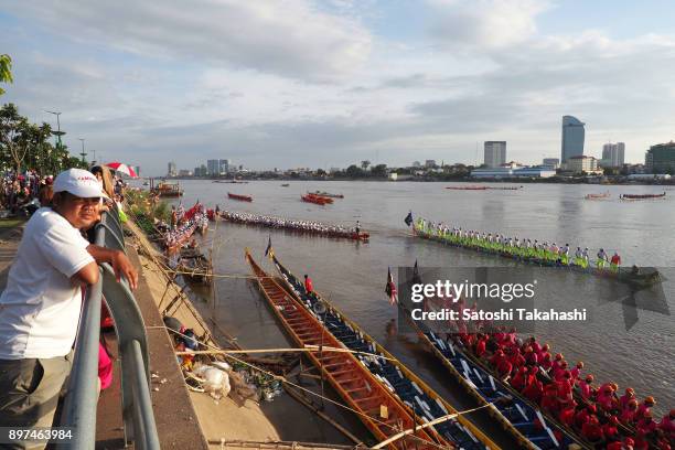 Cambodian participants row their dragon boats on the Tonle Sap river during the first day of the three-day Water Festival boat race. The country's...