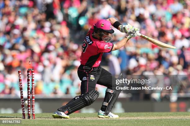 Peter Nevill of the Sixers is bowled by Mitchell Johnson of the Scorchers during the Big Bash League match between the Sydney Sixers and the Perth...
