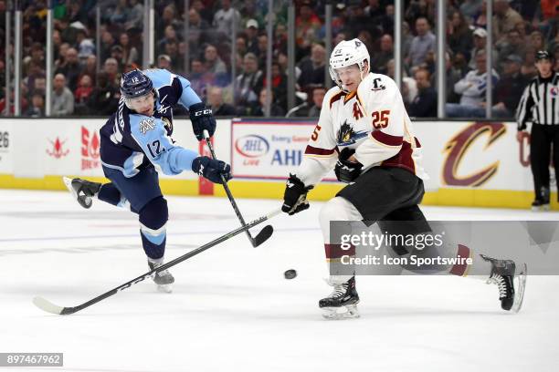 Cleveland Monsters center Alex Broadhurst attempts to block the shot of Milwaukee Admirals right wing Bobby Butler during the third period of the...