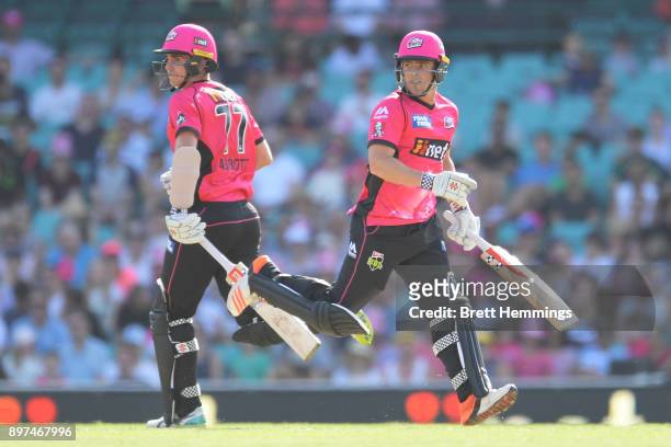 Sean Abbott of the Sixers and Stephen O'Keefe of the Sixers run between the wicket during the Big Bash League match between the Sydney Sixers and the...
