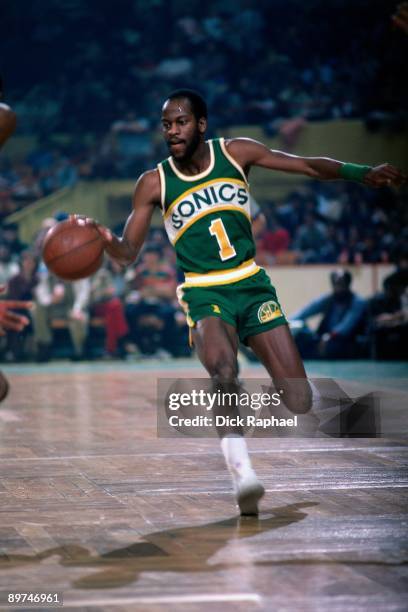 Gus Williams of the Seattle Sonics moves the ball up court against the Boston Celtics during a game played in 1978 at the Boston Garden in Boston,...