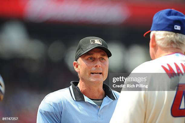 Umpire Dan Iassogna argues with Charlie Manuel, manager of the Philadelphia Phillies in the game against the Chicago Cubs at Citizens Bank Park in...