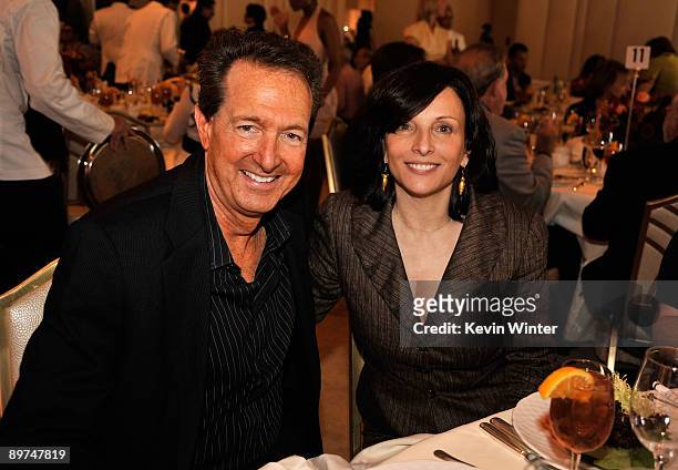 Executive producer Barry Adelman and president of Dick Clark Productions Orly Adelson pose during the Hollywood Foreign Press Association's...