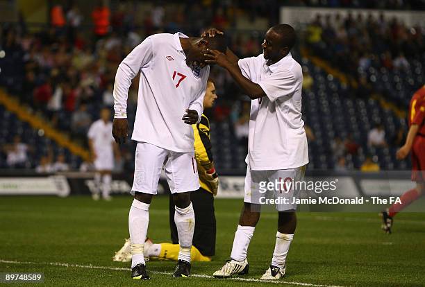 Tope Obadeyi celebrates his goal with Febian Brandy of England U20 during the England U20 and Montenegro U20 match at The Hawthorns on August 11,...