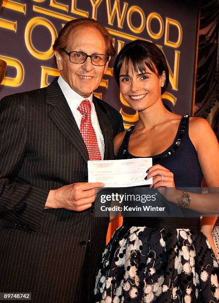 Hollywood Foreign Press Association president Philip Berk and actress Jordana Brewster onstage during the Hollywood Foreign Press Association's...