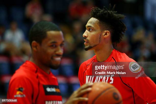 Bryce Cotton and Jean-Pierre Tokoto of the Wildcats warm up before the round 11 NBL match between the Illawarra Hawks and the Perth Wildcats at...