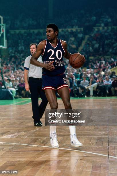 Micheal Ray Richardson of the New York Knicks moves the ball up court during a game against the Boston Celtics played in 1980 at the Boston Garden in...