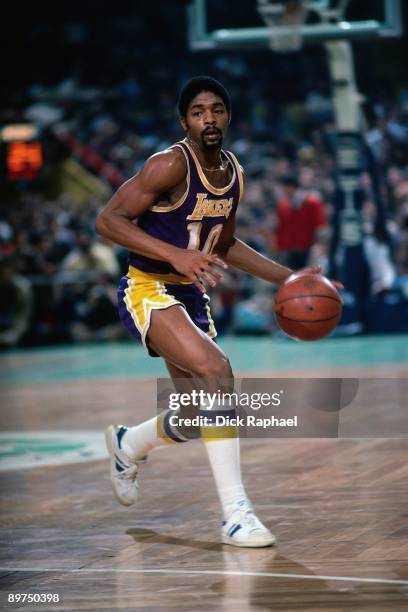 Norm Nixon of the Los Angeles Lakers moves the ball up the court during a game played in 1980 at the Boston Garden in Boston, Massachusetts. NOTE TO...