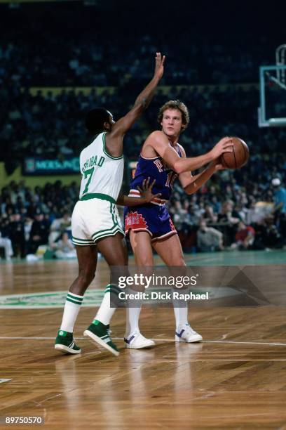 Don Buse of the Phoenix Suns looks to move the bal against Nate Archibald of the Boston Celtics during a game played in 1980 at the Boston Garden in...