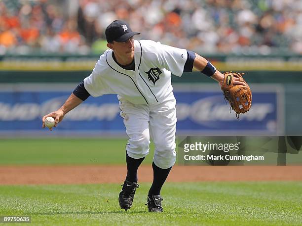 Brandon Inge of the Detroit Tigers fields against the Minnesota Twins during the game at Comerica Park on August 9, 2009 in Detroit, Michigan. The...