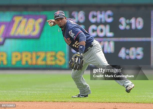 Alexi Casilla of the Minnesota Twins fields against the Detroit Tigers during the game at Comerica Park on August 9, 2009 in Detroit, Michigan. The...