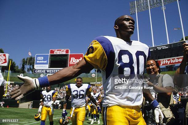 Wide receiver Isaac Bruce of the Los Angeles Rams enters the field prior to an exhibition game against the Oakland Raiders at at the Oakland/Alameda...