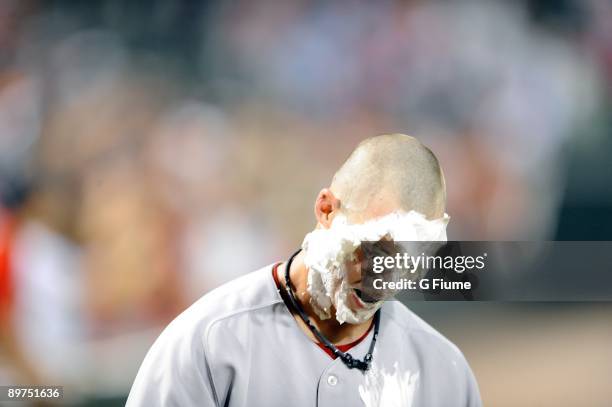 Josh Reddick of the Boston Red Sox gets a shaving cream pie in the face after the game against the Baltimore Orioles at Camden Yards on August 1,...