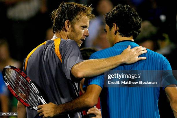 Frederic Niemeyer of Canada congratulates Roger Federer of Switzerland after their match during the Rogers Cup at Uniprix Stadium on August 11, 2009...