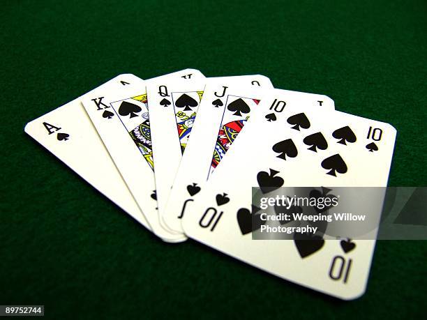 a hand of cards. - royal flush stock-fotos und bilder
