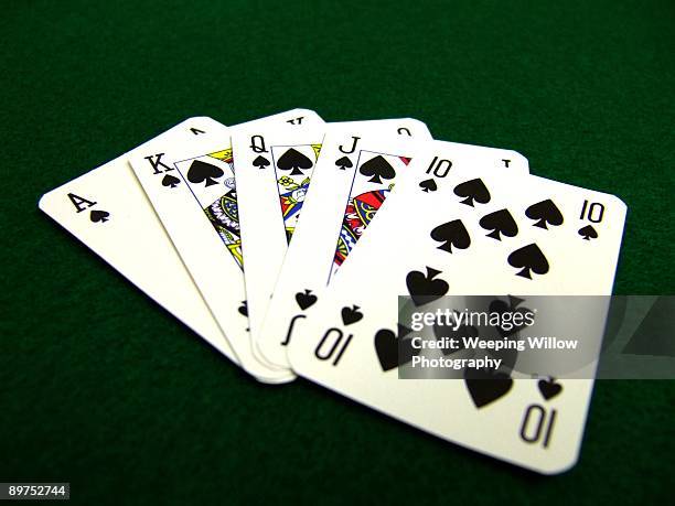 a hand of cards. - royal flush stockfoto's en -beelden