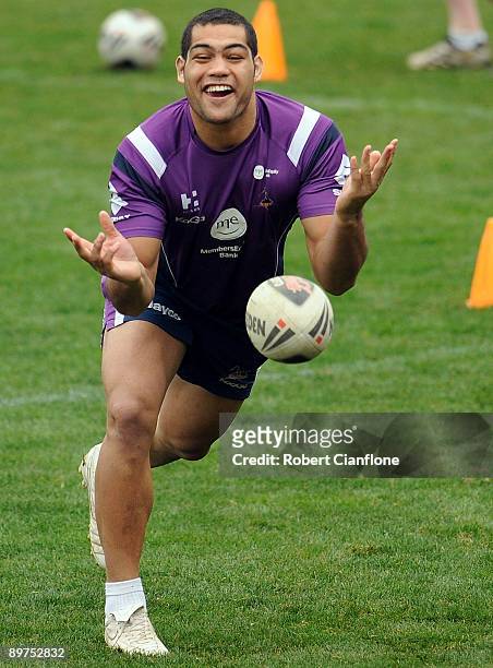 Sika Manu of the Storm passes the ball during a Melbourne Storm NRL training session at Visy Park on August 12, 2009 in Melbourne, Australia.
