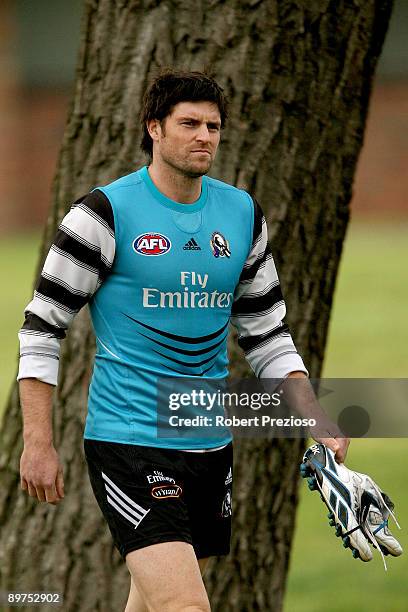 Leigh Brown walks towards the waiting media to answer questions about his 200th AFL game during a Collingwood Magpies AFL training session at Gosch's...