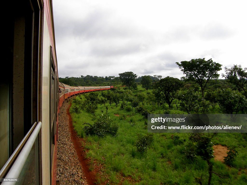 Train in motion in African landscape, from window
