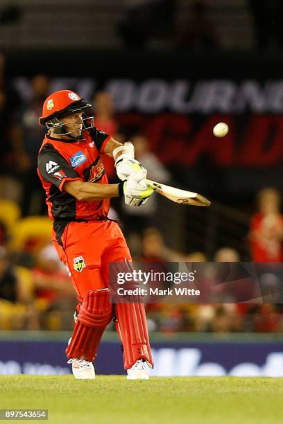 Brad Hodge of Melbourne Renegades hits a six during the Big Bash League match between the Melbourne Renegades and the Brisbane Heat at Etihad Stadium...