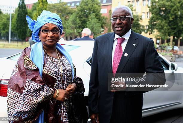 Council member and President of the IAAF Lamine Diack arrives with his wife Bintou Diack at the opening ceremony of the 47th IAAF Congress at the...