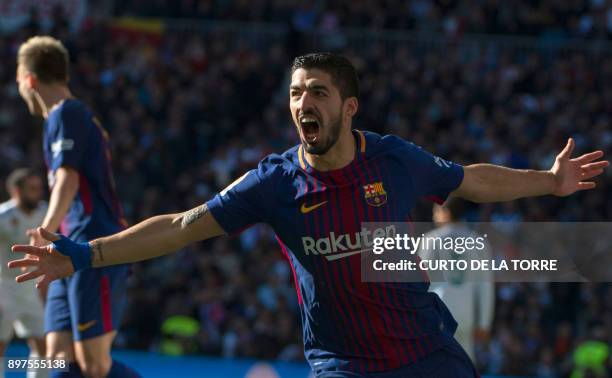 Barcelona's Uruguayan forward Luis Suarez celebrates after scoring during the Spanish League "Clasico" football match Real Madrid CF vs FC Barcelona...