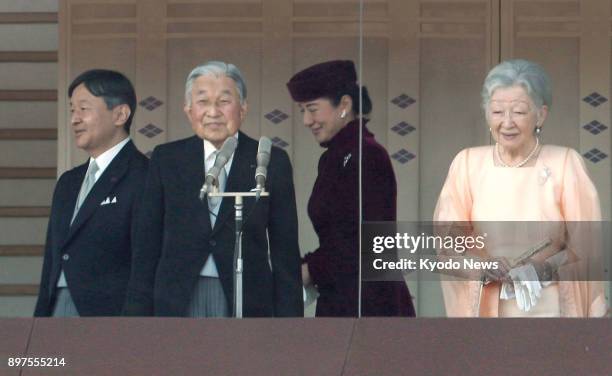 Japanese Crown Prince Naruhito, Emperor Akihito, Crown Princess Masako and Empress Michiko arrive at a balcony of the Imperial Palace in Tokyo to...