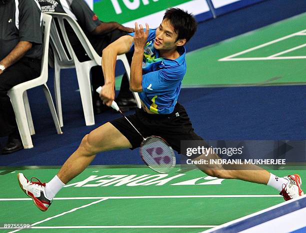 Taiwan's Yu Hsing Hsieh plays a shot against Wei Ng of Hong Kong during the men's singles second round badminton match of the World Badminton...