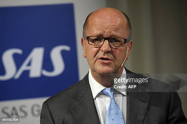 Scandinavian flight carrier SAS CEO Mats Jansson presents the company's second-quarter earnings report during a press conference in Stockholm on...