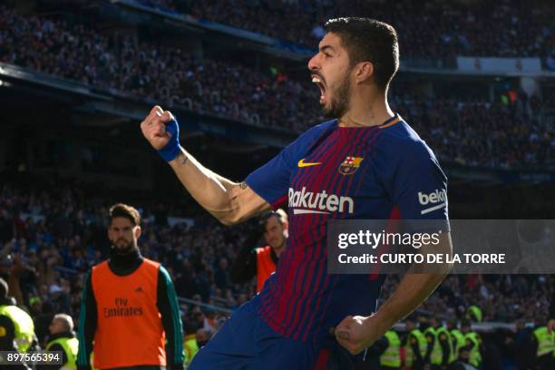 Barcelona's Uruguayan forward Luis Suarez celebrates after scoring during the Spanish League "Clasico" football match Real Madrid CF vs FC Barcelona...
